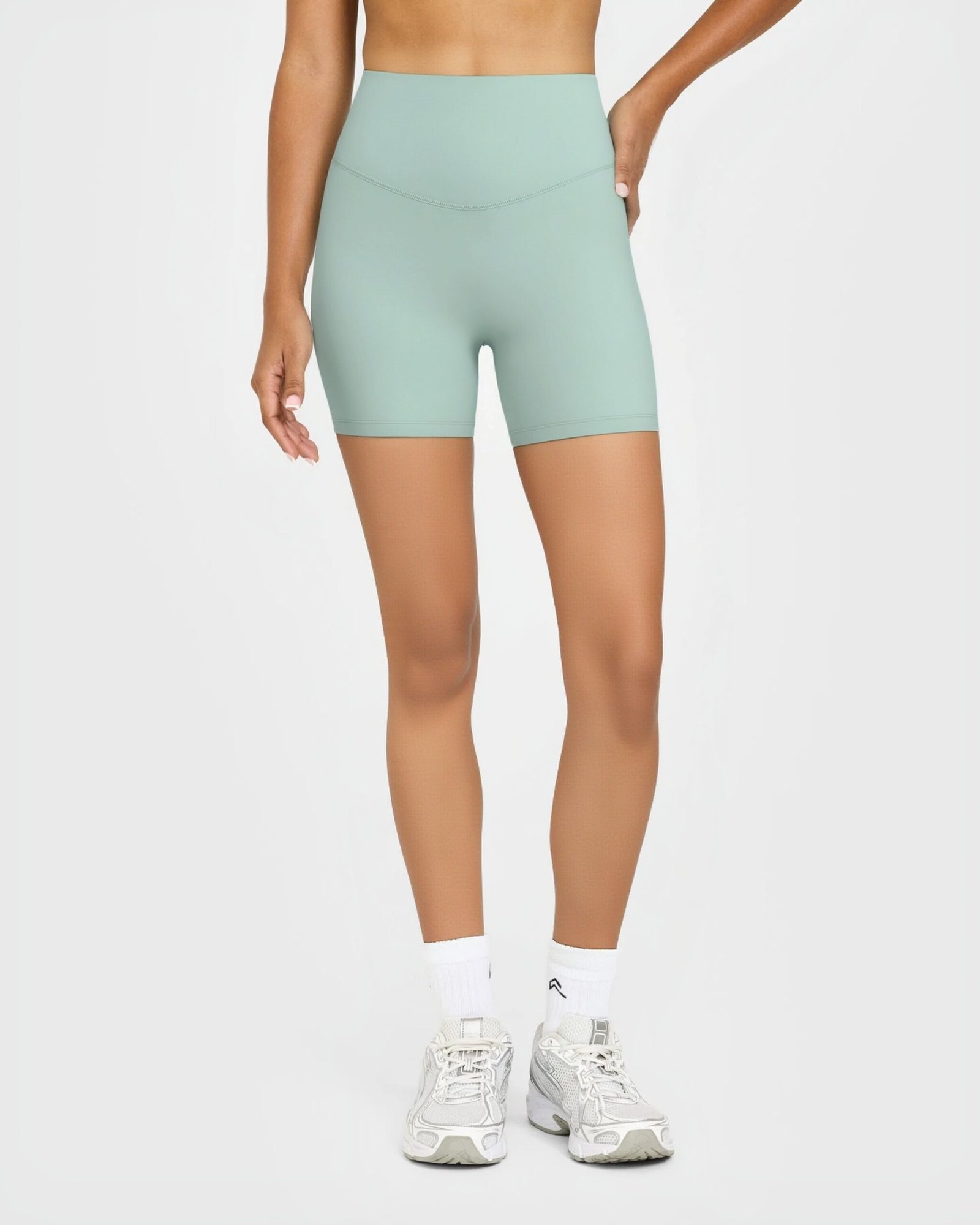 Women's High-Rise Bike Shorts with Cross-Over Waistband running — custom OEM activewear by New...