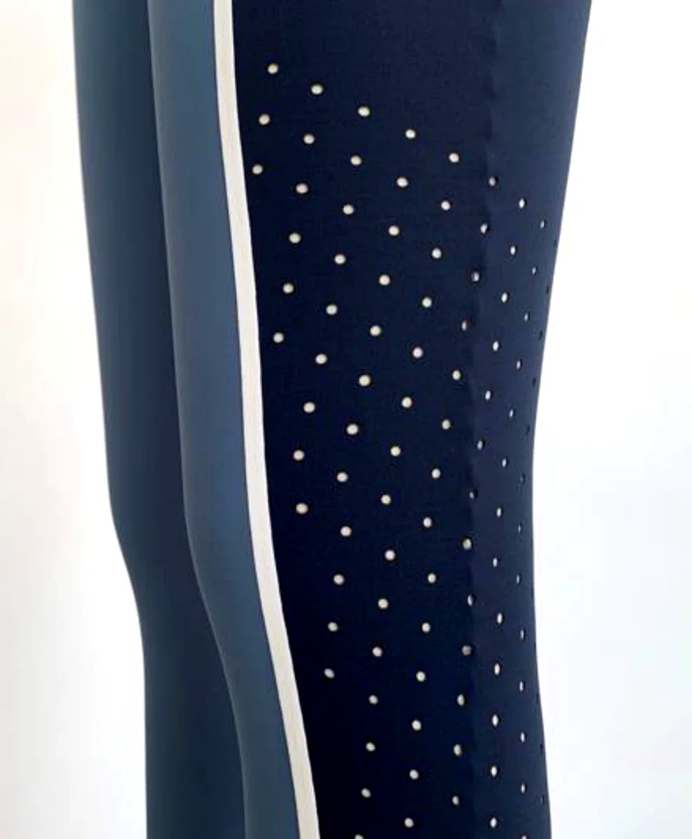 Laser-cut perforation detail down a legging